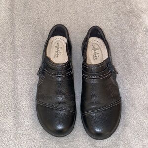 Black leather Clark slip on shoes. Size 6.5